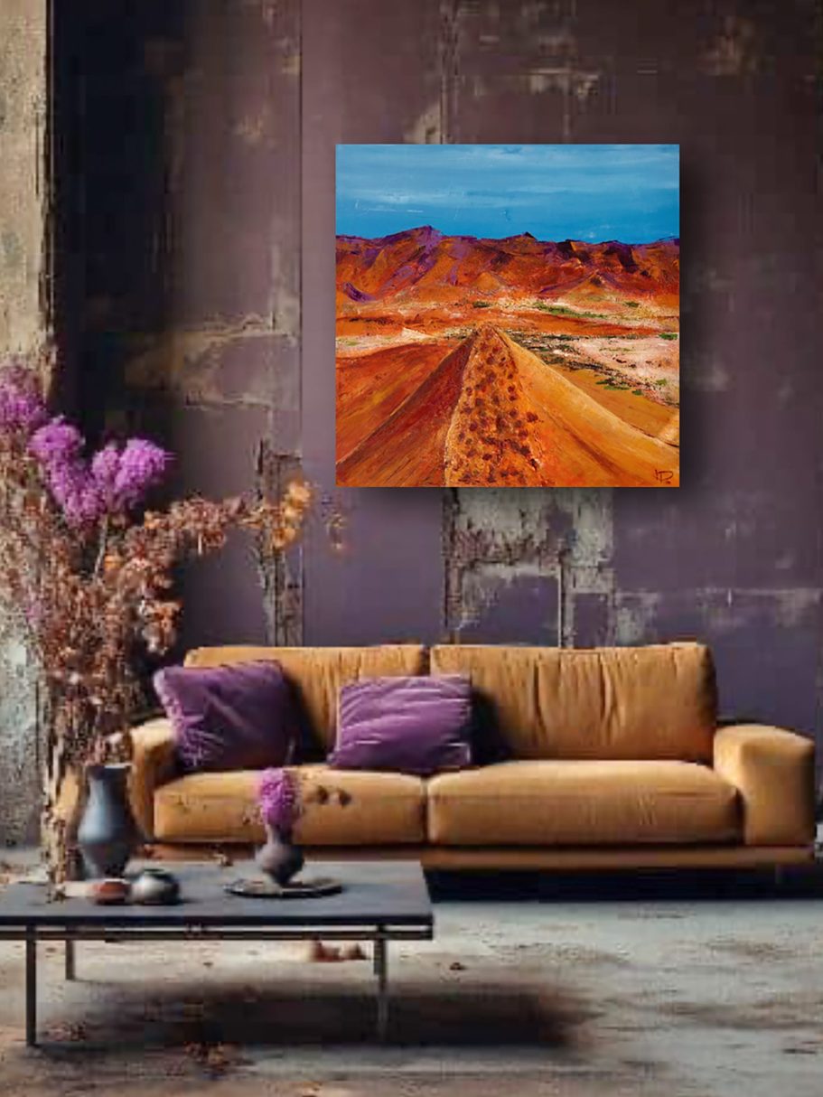 Moderne Einrichtung mit beigem Sofa, Tisch und farbenfrohem Landschaftsbild an der Wand.